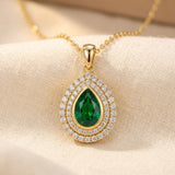 Vesipisarakaulakoru kullasta ja smaragdista